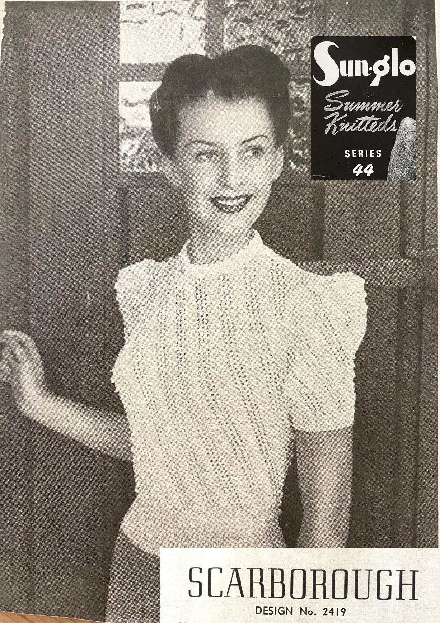 Diagonal Eyelet Sweater with Bobbles